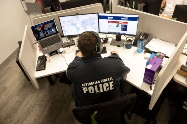 Forensic accountant looking at computer screens