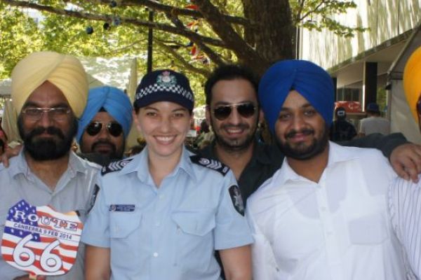 AFP Community Liaison Officer with members of the community