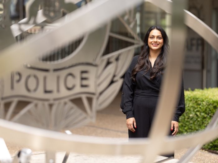 Professional AFP member standing in front of an AFP building