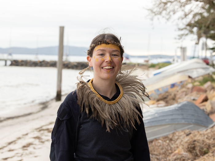 Worimi woman wearing aboriginal artefacts