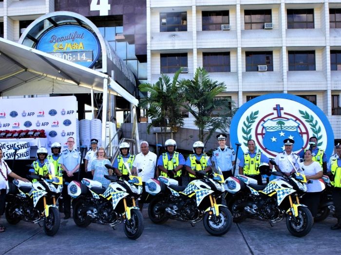 AFP and Samoa Police, Prisons and Correction Services officers standing with new equipment 