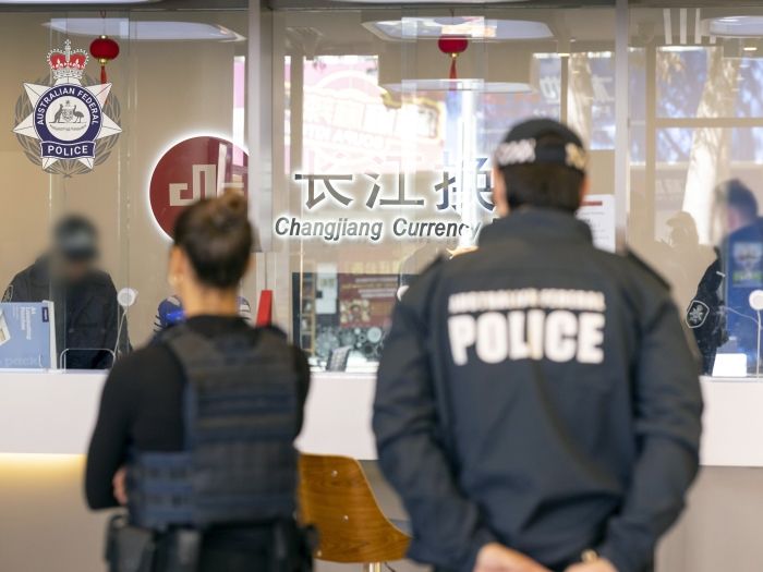 AFP officers at shopfront in Sydney CBD