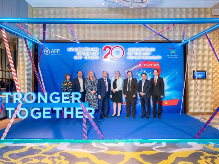 Officials from the Australian and Vietnamese Governments pose for a photograph at the 20th anniversary event