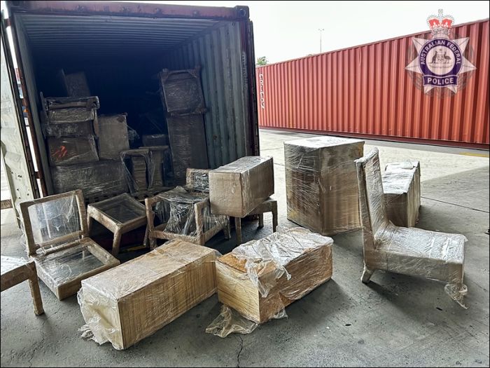 Wrapped plastic furniture in front of truck