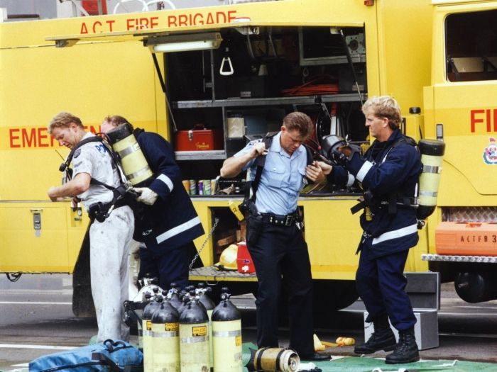 AFP members putting on breathing appartus