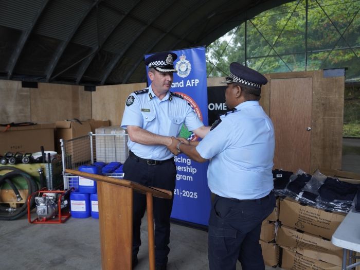 RSIPF and AFP members shaking hands
