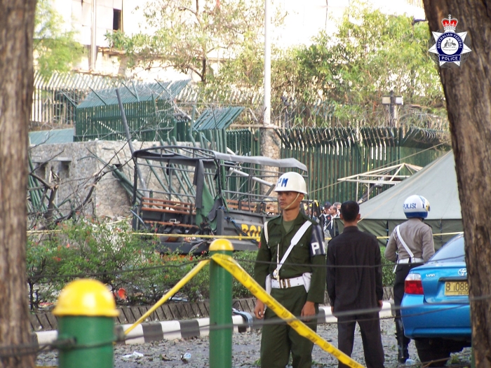 Indonesian Police guard the remains of the truck used to carry out the bombing