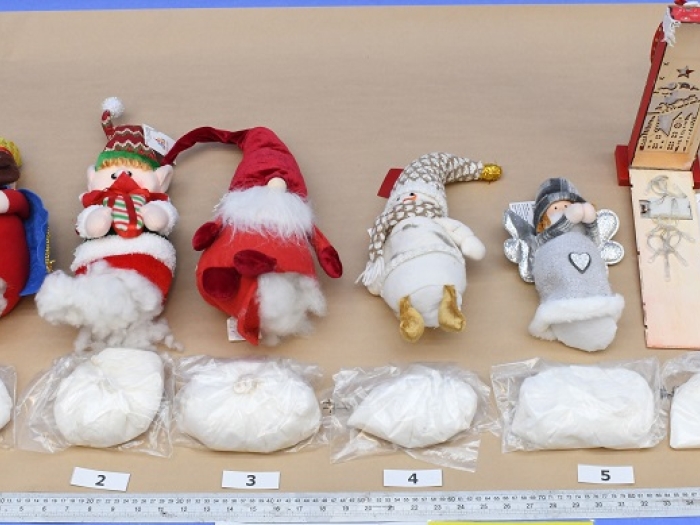 Image of six Christmas toys laying on a table with the Ketamine that was hidden inside them on show benefit each toy