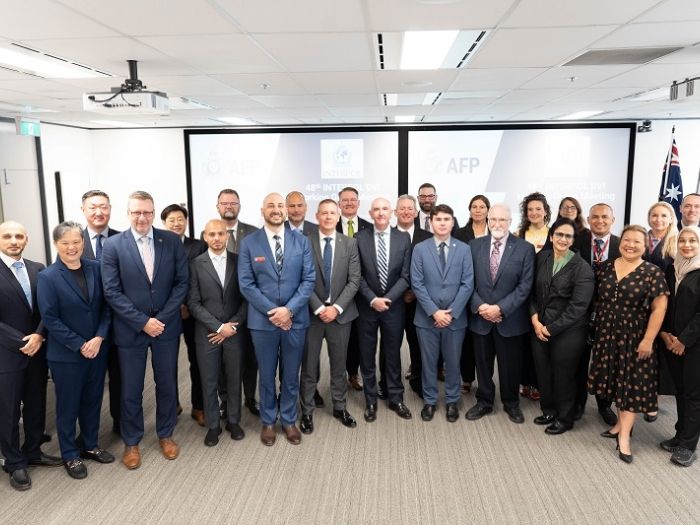 Members of the INTERPOL DVI working group standing together for a group photograph. 