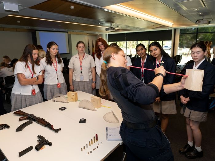 Students receive ballistics presentation for International Day for Women and Girls in Science