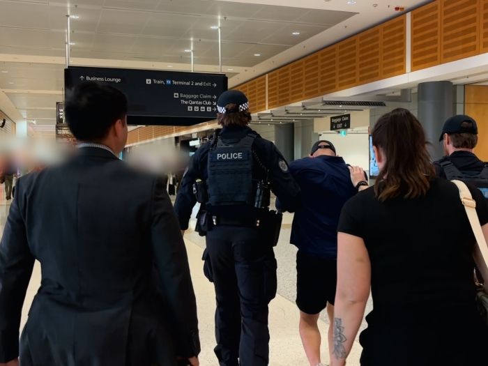 Arrest of alleged fugitive at Sydney Airport