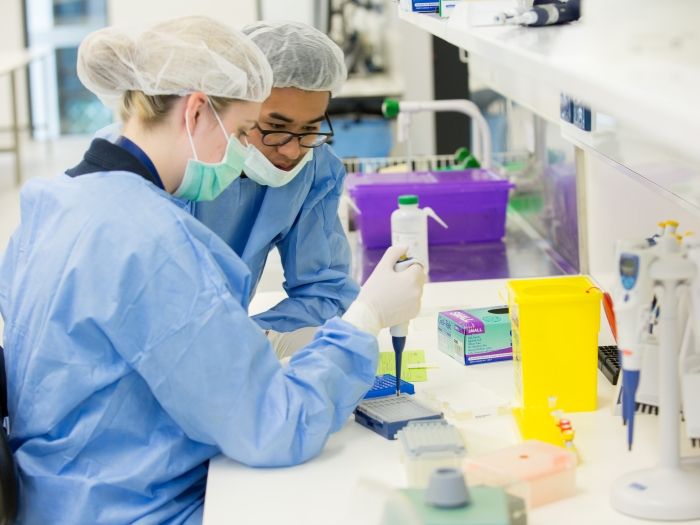 Two people in the forensics laboratory using a Biohit Dropper