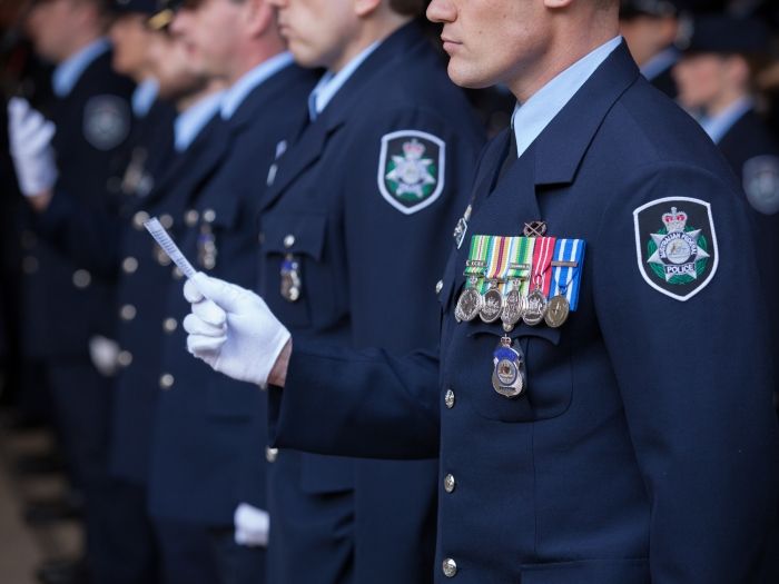 Multiple officers lined up in AFP dress uniform for a ceremony