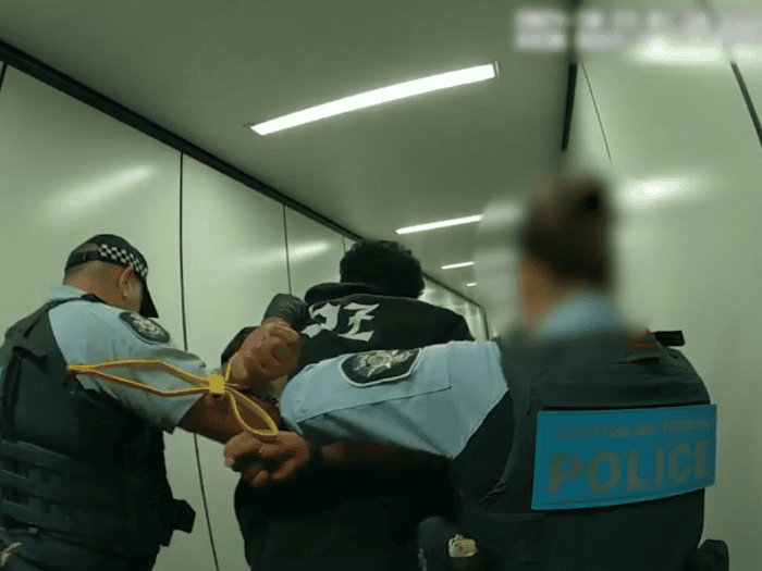 Man arrested by AFP officers in October 2024
