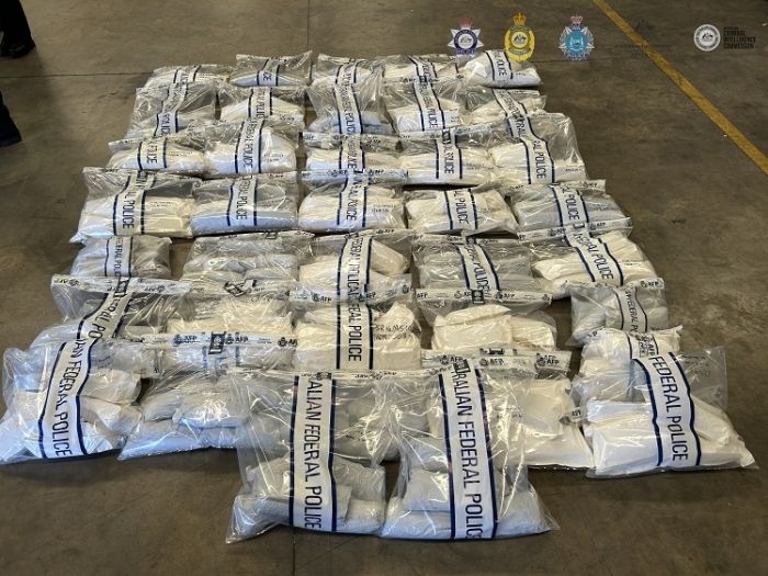 Methamphetamine in evidence bags displayed on the ground