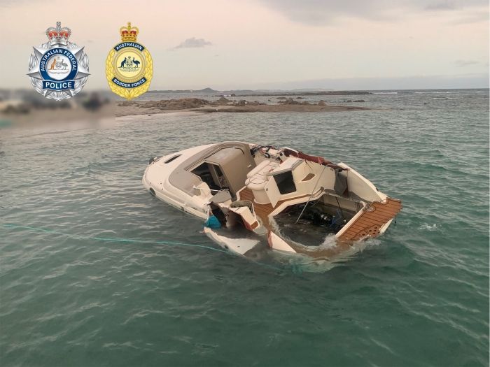 A capsized cruiser vessel in shallow waters off Denmark