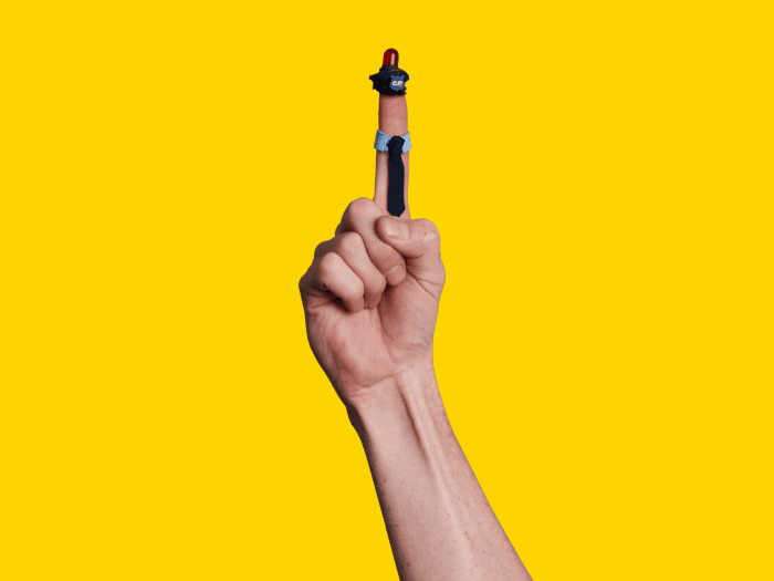 Image of a hand with a finger dressed like a police officer