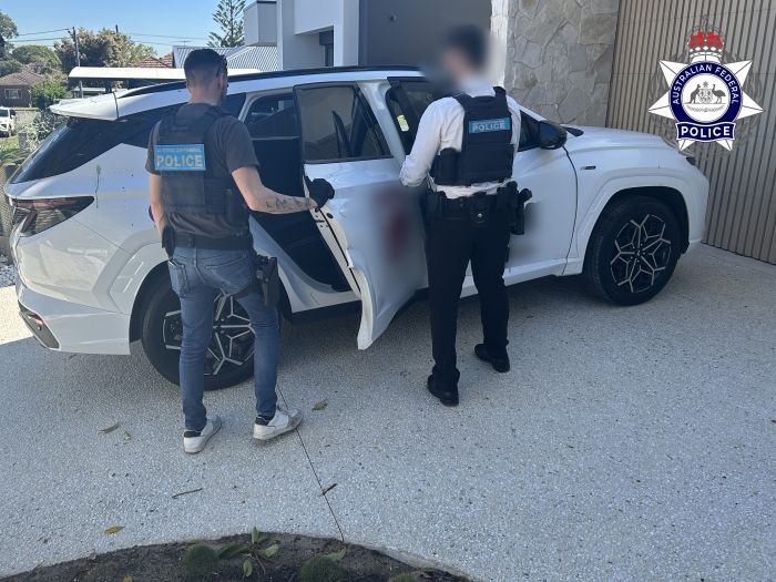 AFP members execute search warrrant