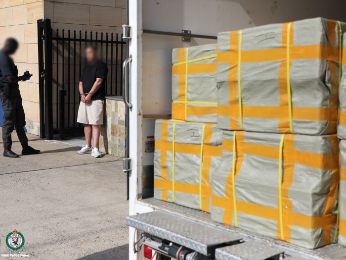 Police arrest a man next to seized assets