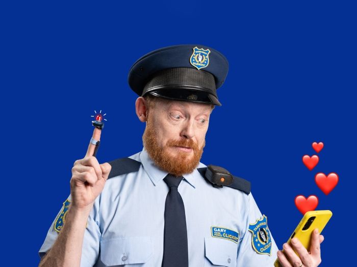 Photo of a ClickFit officer with a light on one finger and a phone in the other hand with hearts coming out of it