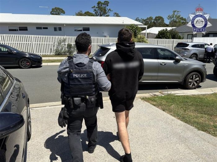 Arrest of QLD man charged for violent extremist material.