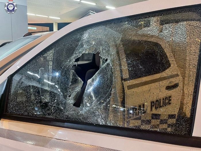 An AFP vehicle with a front side window smashed