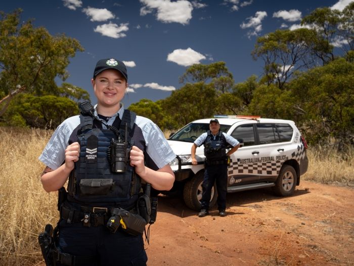 PSOs in front of an AFP vehicle 