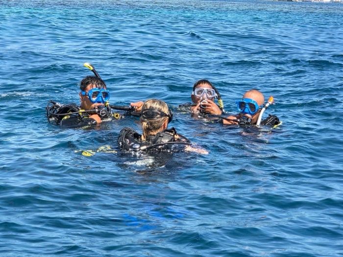 Divers in the water as part of dive trraining for Kiribati Police