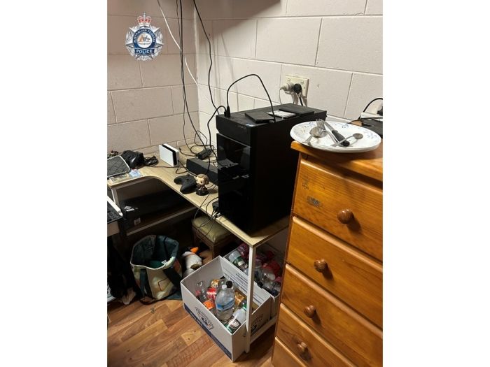 Image of a room searched during warrant activity at Innisfail residence.