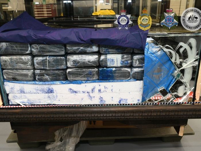 Three people charged over cocaine import