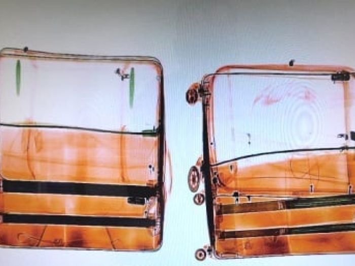 X-rays were used to discover approximately 6kg of cocaine allegedly concealed in the baggage of two Brazilian nationals.