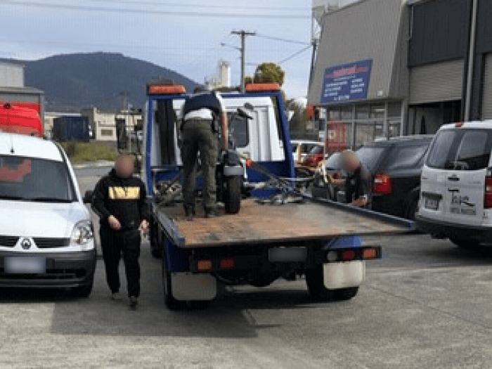 The seized bike loaded onto a tow truck