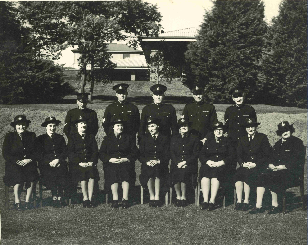 Members of the Defence Establishment Guard circa 1940, including 9 women seated in the front row (AFP MRN 12934)