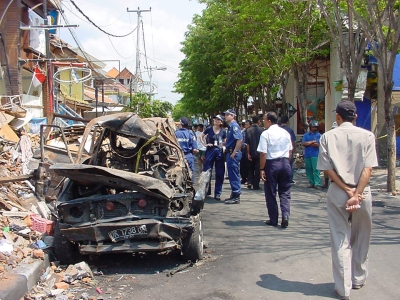 AFP Forensics survey the bombing site at Jelan Legian