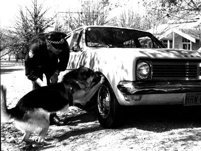 1983: Senior Constable Garry Baker with the AFP’s first canine, Kaiser (AFPM9287)