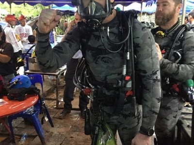 A member of the Wild Boars soccer team on a flexible stretcher is moved through one of the last three chambers of the Tham Luang Nang Non cave system.