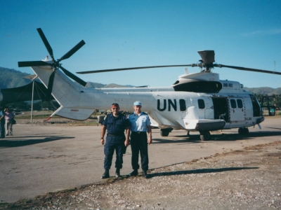 United Nations missions use aircraft for mobility and transport purposes. Here an Australian police peacekeeper and a colleague are standing near a Super Puma UN helicopter, in East Timor in 2000