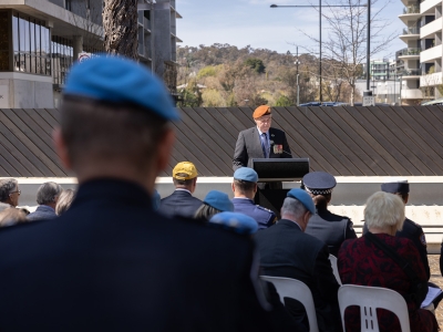 Former peacekeepers speaking at the 60 Years of police peacekeeping memorial service at the National Peacekeepers Memorial.