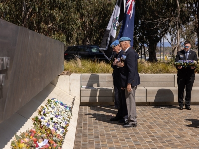 Former peacekeepers laying wreaths of remembrance at the 60 Years of police peacekeeping memorial service at the National Peacekeepers Memorial. Both men were part of the first Australian contingent to Cyprus in 1964.