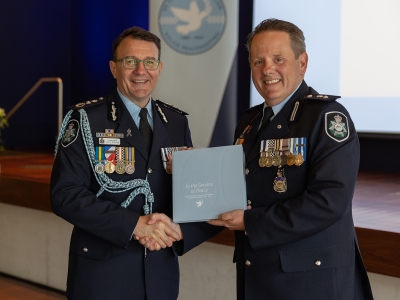 AFP Commissioner Reece P Kershaw with Superintendent Jason Byrnes launching 'In the Service of Peace' book at the 60 years of police peacekeeping lunch.